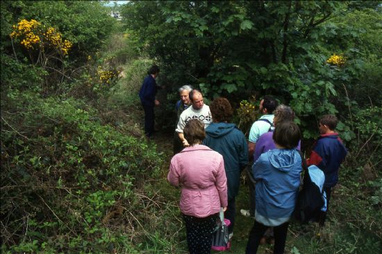 Group of people in woodland scrub
