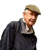 Head and shoulders photo of man in a flat cap and blue waterproof