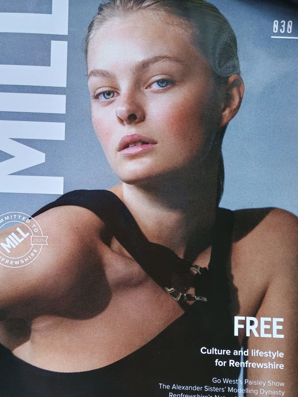 Front cover of a magazine titled Mill, with head and shoulder photograph of model in a black dress